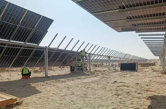 Rows of tracker-mounted solar modules at Al Dhafra PV2